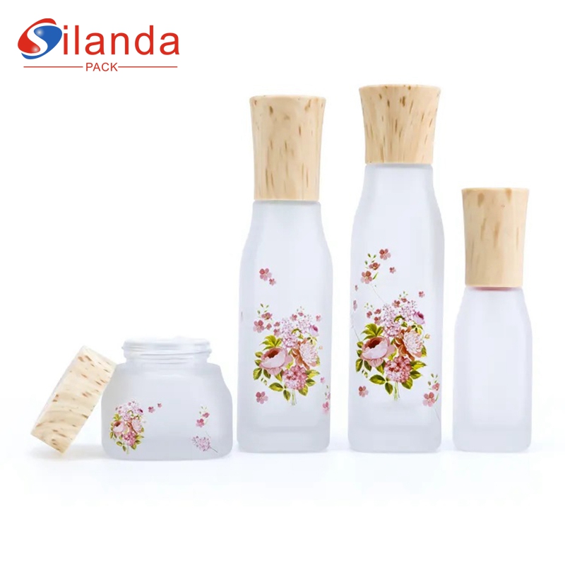 Frosted Applique Glass Cosmetic Skincare Bottle Set Toner Lotion Serum Pump Bottles Cream Jar with Wood Lid 