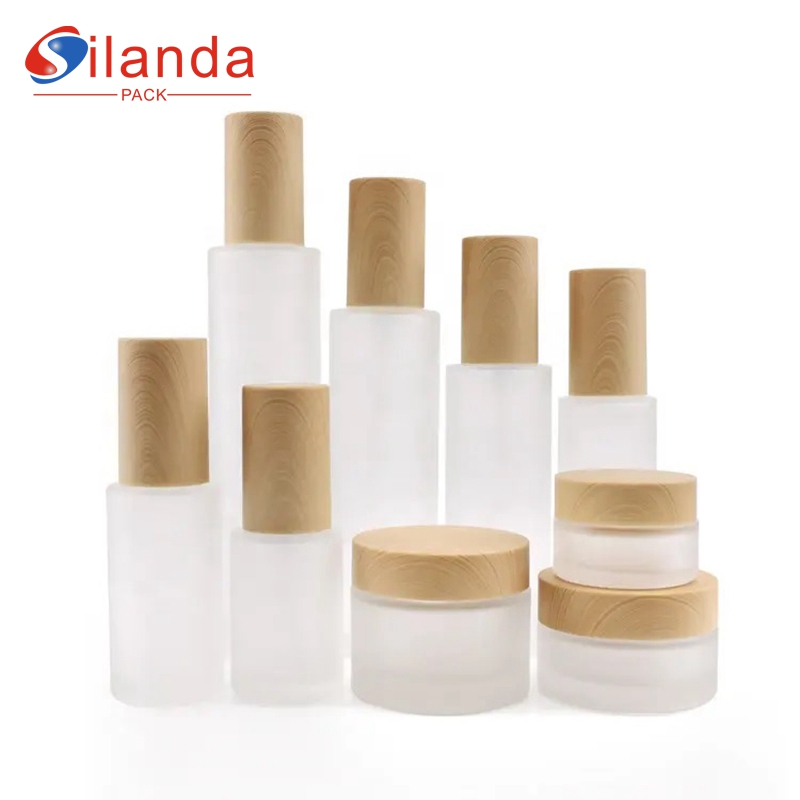 Elegant Frost Bamboo Lid Glass Skincare Bottle Set Cosmetic Toner Lotion Serum Pump Bottles Cream Jars  